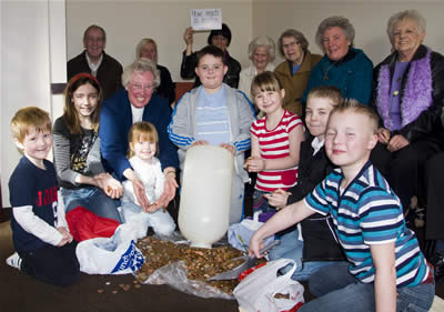 Giant bottle of change is emptied at St. Anne's
